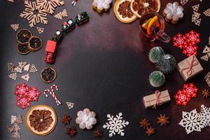 Hot mulled wine with a slice of orange, with cinnamon, cloves and other spices photo