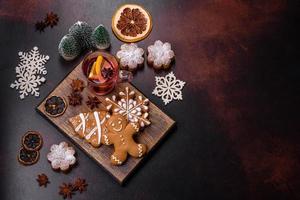 Hot mulled wine with a slice of orange, with cinnamon, cloves and other spices photo