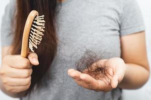 woman having hair loss problem photo