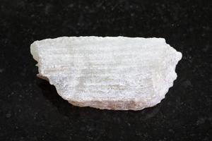 raw Talc stone on dark background photo