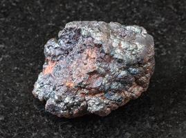 raw Goethite stone on black photo