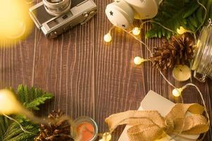 Christmas lights bokeh in home on wooden table  decorations. Winter  Holiday decoration, Christmas and New year decorations concept photo