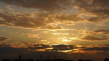 The beautiful sunset view with the colorful clouds and sky in the city photo