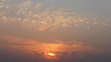 The beautiful sunset view with the colorful clouds and sky in the city photo