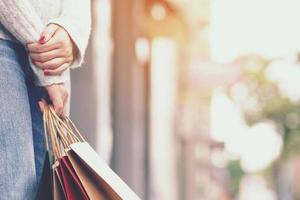 woman holding shopping bags mall photo