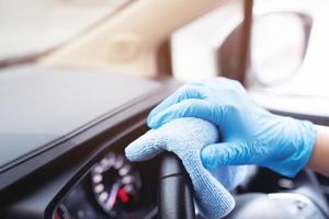 Staff is cleaning the inside of the car photo