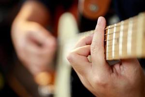 A musician plays an electric guitar at a concert. photo