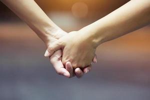 Couples hold hands together at night, romantic atmosphere. photo