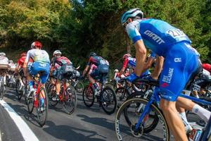 Italy 2022 Giro di Lombardia group cyclists engaged in the ascent of Dossena photo