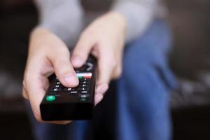 A woman is watching a soccer moment on the TV photo