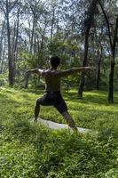 man seen up close, without shirt doing stretches on yoga mat, exercise, latin america photo