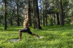 mexican man doing yoga and stretching in the forest, mexico photo