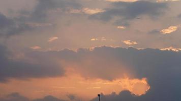 The beautiful sunset view with the colorful clouds and sky in the city photo