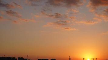 The beautiful sunset view with the colorful clouds and sky in the city photo