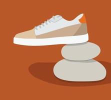 Shoe on stones vector design isolated on orange background. Shoe logo template design.