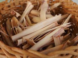 Close up dried lemon grass in a bamboo woven basket photo