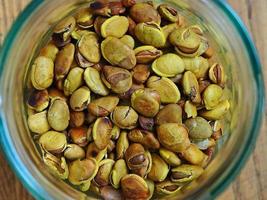 Roast lablab bean in a glass jar photo