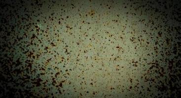 Brown rust spots surface on white painted metal.  vintage style vignette photo