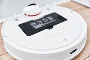 Repair robot vacuum cleaner, closeup. Household appliance service photo