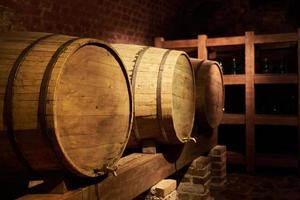 Two wine barrels in old wine cellar photo