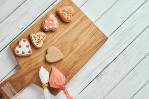 Decorated gingerbread cookies with icing on the table photo