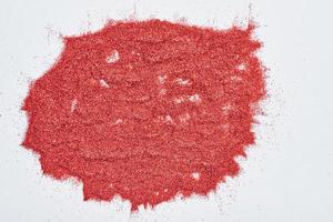 Abstract texture. A red glitter background photo