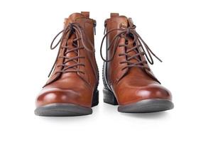 Pair of brown leather womens boots on the white background isolated photo