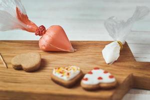 Decorated gingerbread cookies with icing on the table photo