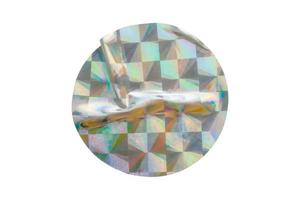 Blank round adhesive holographic foil sticker label isolated on white background photo