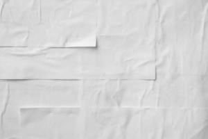 white crumpled and creased paper poster texture background photo