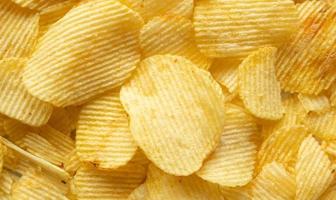 crispy golden potato chips snack texture background photo