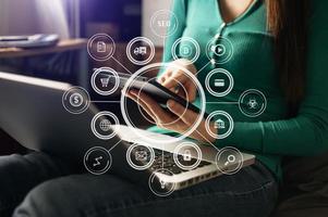Businessman working with smart phone and laptop and digital tablet computer with digital marketing media in virtual icon photo