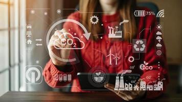Business working with reduce CO2 concept with icons, global warming such as reforest green factory recycle and zero carbon dioxide emission concept. with VR icon at office photo