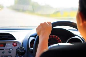 Woman driving on the road photo