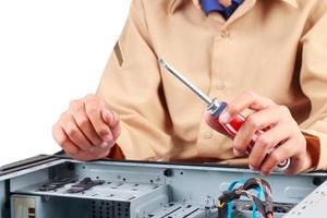 Technical specialists are repairing computers, electronic devices. photo
