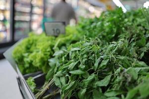 Fresh vegetables in supermarket are clearly marked with price tags. photo