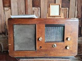 Closeup wooden vintage radio in the old house photo