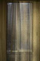Curtains on window. Light through fabric. photo