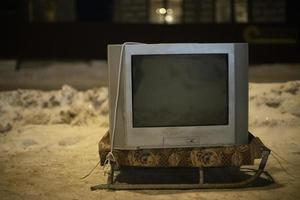 Old TV outside. TV is off. Electronics of 90s. photo