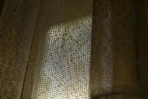 Curtains on window. Light through fabric. photo