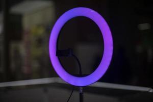 Purple lamp for blogging. Round LED lamp. photo