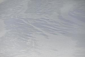 Texture of snow. Background is snowy plain. photo
