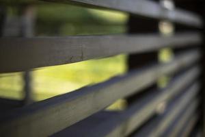 Wooden veranda. Fence in house. Details of architecture in countryside. photo