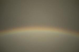 Rainbow in sky. Atmospheric phenomenon. Refraction of light. photo