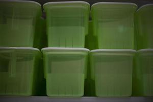 Food containers in store. Plastic boxes. Food storage tanks. Plastic objects. photo