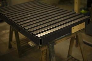 Steel table. Industrial processing. Details of work with structure. photo