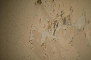 Torn paper on wall. Texture of wall. Change of wallpaper. photo