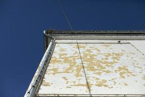 Old wall of house. Empty advertising space on building. photo