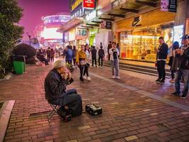 Changsha.China-17 October 2018.Unacquainted Senior street performers singing at huangxing walking street in Changsha city China.changsha is the capital and most populous city of Hunan province china photo