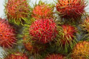 Red rambutans closeup on the white background. photo